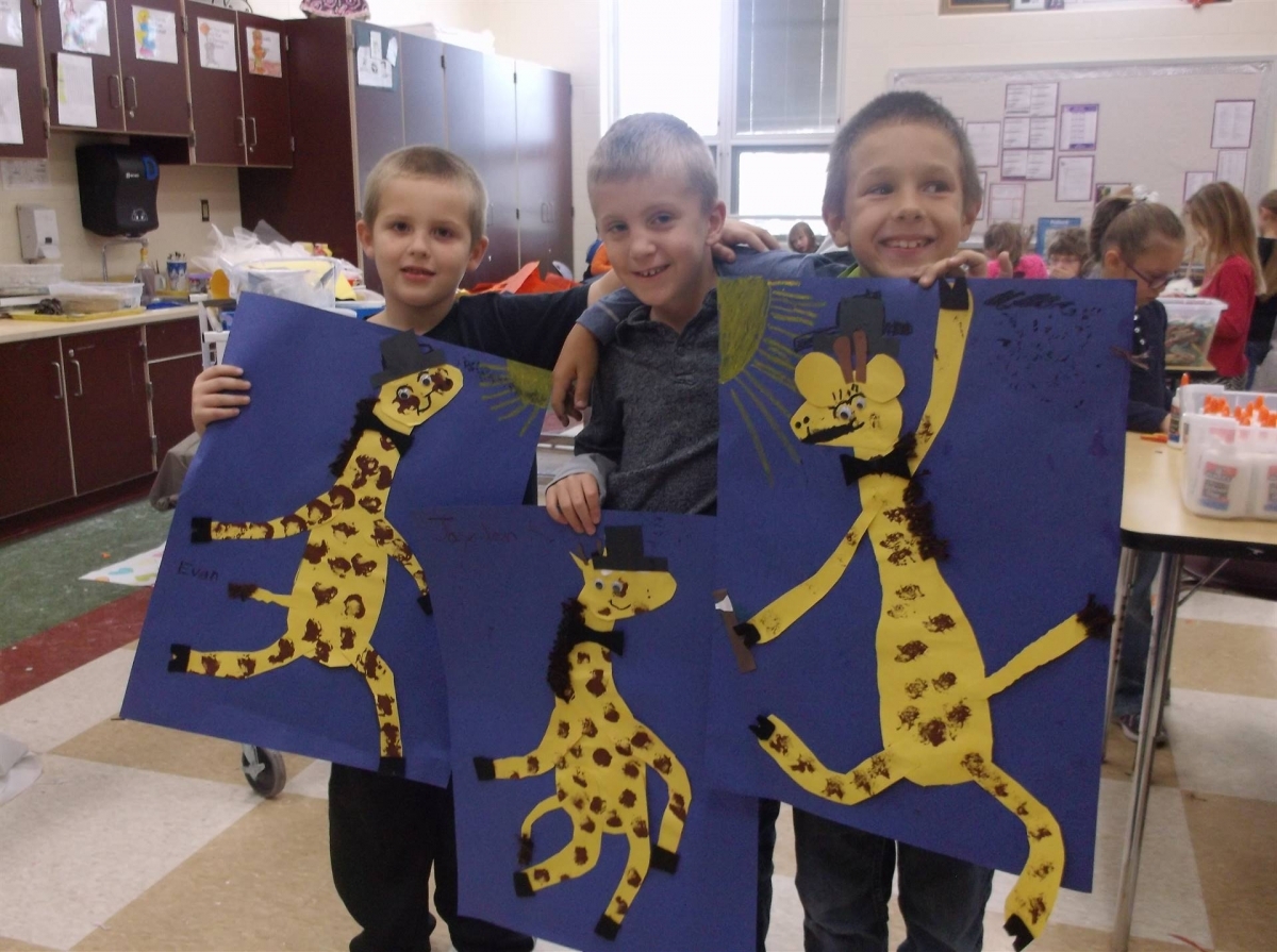 3 boys with giraffe artwork